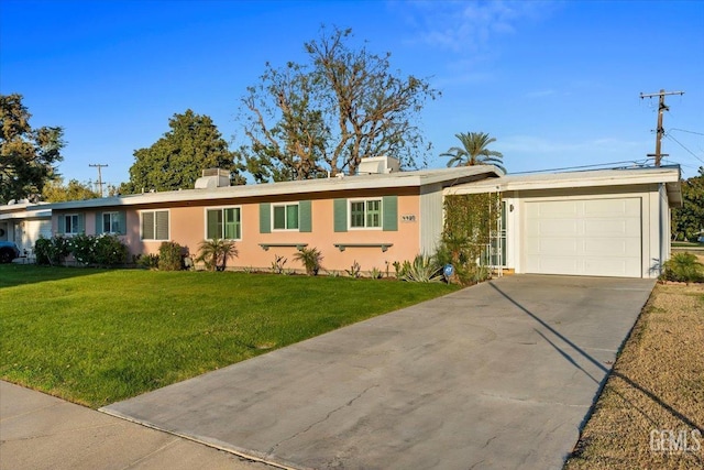 single story home with a front yard and a garage