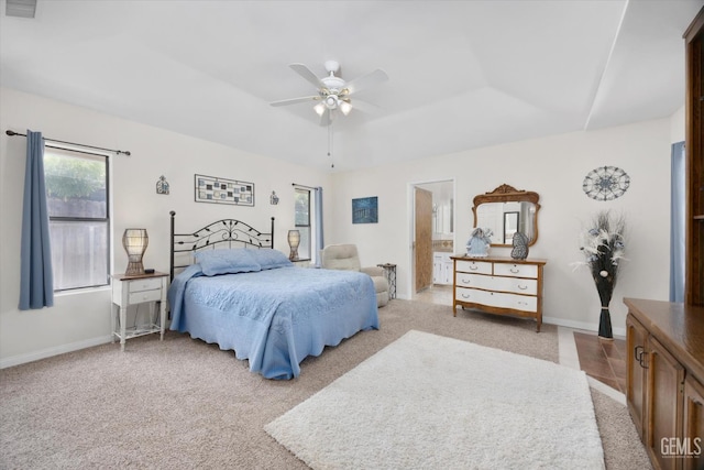 6801 Weldon Ave, Bakersfield, CA 93308 - bedroom with multiple windows, light colored carpet, a raised ceiling, and baseboards