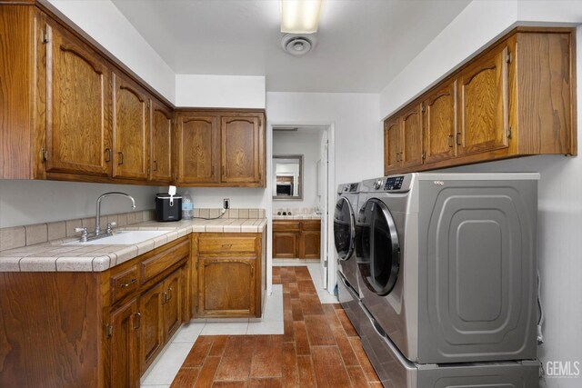 6801 Weldon Ave, Bakersfield, CA 93308 - laundry room featuring washing machine and clothes dryer and cabinet space
