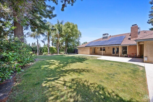 6801 Weldon Ave, Bakersfield, CA 93308 - view of green lawn with a patio area