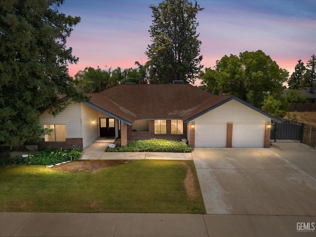 6801 Weldon Ave, Bakersfield, CA 93308 - single story home featuring brick siding, an attached garage, and driveway