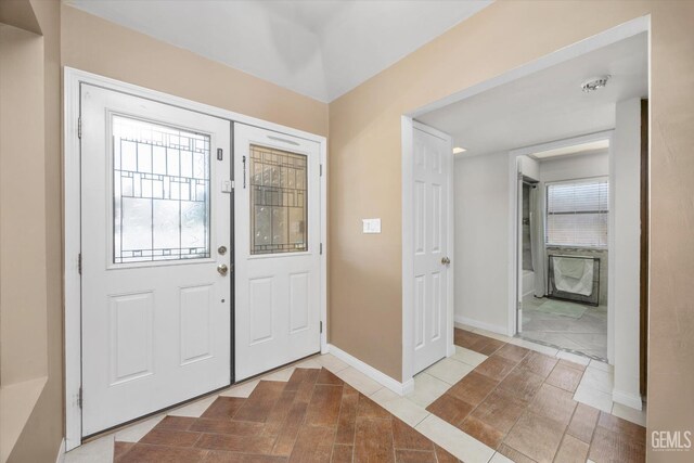 6801 Weldon Ave, Bakersfield, CA 93308 - foyer with baseboards and tile patterned flooring