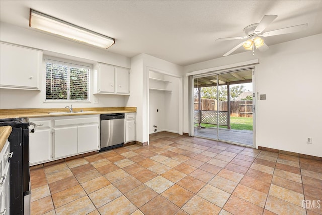 kitchen with electric range, dishwasher, light countertops, white cabinetry, and a sink