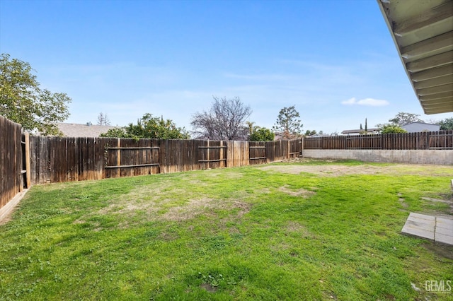 view of yard featuring a fenced backyard