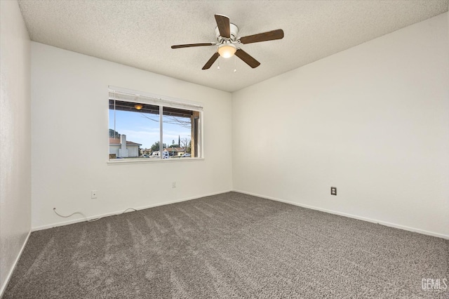 unfurnished room with a textured ceiling, ceiling fan, dark carpet, and baseboards