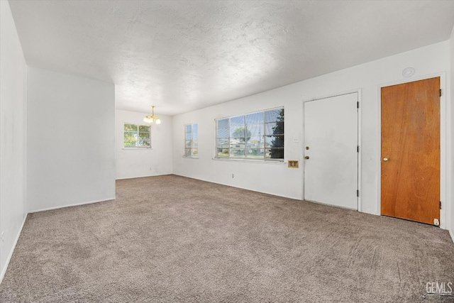 3201 Pomona St, Bakersfield, CA 93305 - unfurnished room with a chandelier and carpet floors