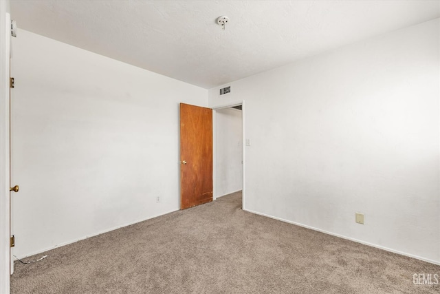 3201 Pomona St, Bakersfield, CA 93305 - carpeted empty room with fire sprinkler in ceiling