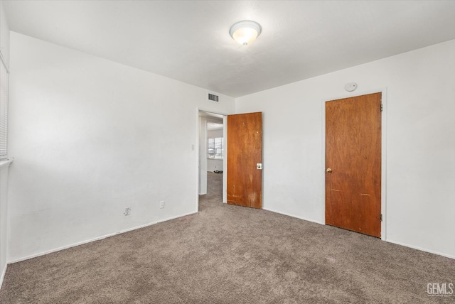 3201 Pomona St, Bakersfield, CA 93305 - unfurnished bedroom featuring carpet floors and baseboards