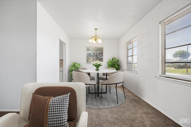 3201 Pomona St, Bakersfield, CA 93305 - dining area featuring a chandelier and carpet flooring