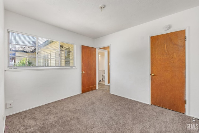 3201 Pomona St, Bakersfield, CA 93305 - unfurnished bedroom featuring carpet flooring and baseboards