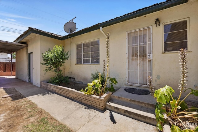 3201 Pomona St, Bakersfield, CA 93305 - doorway to property featuring stucco siding