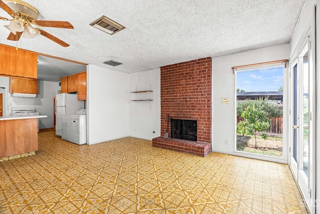 102 Wetherley Dr, Bakersfield, CA 93309 - unfurnished living room featuring a ceiling fan, a textured ceiling, and a brick fireplace