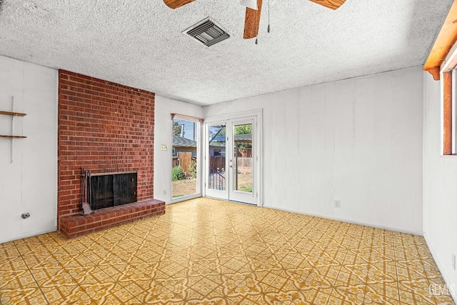 102 Wetherley Dr, Bakersfield, CA 93309 - unfurnished living room featuring ceiling fan, a brick fireplace, and a textured ceiling