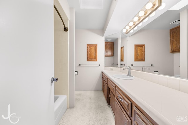 bathroom with vanity, speckled floor, visible vents, and shower / washtub combination
