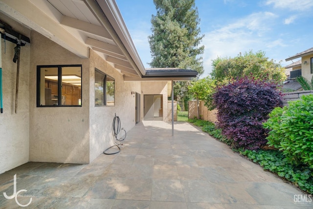 view of patio / terrace featuring fence