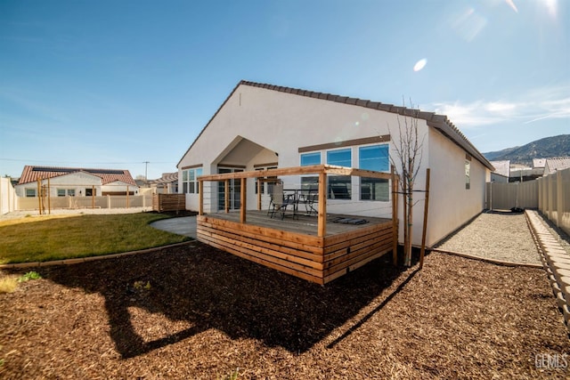 back of house featuring a patio and a lawn