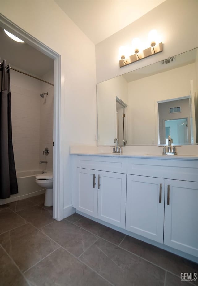 full bathroom featuring shower / tub combo with curtain, vanity, toilet, and tile patterned floors