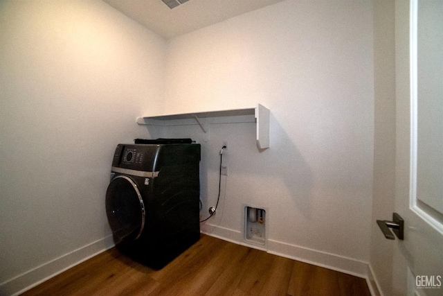 washroom featuring wood-type flooring and washer / dryer