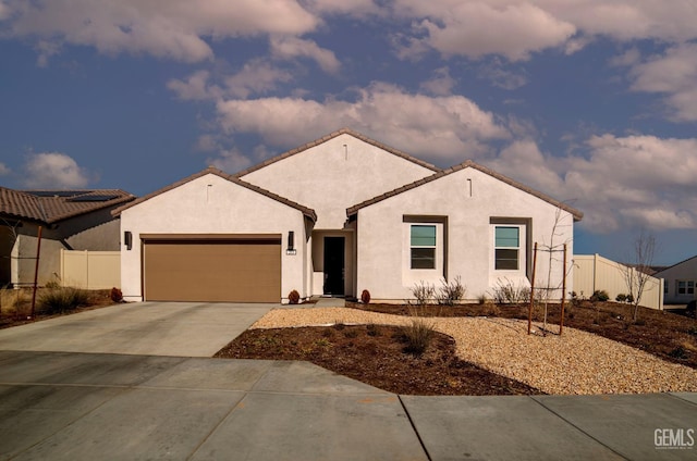 mediterranean / spanish home featuring a garage