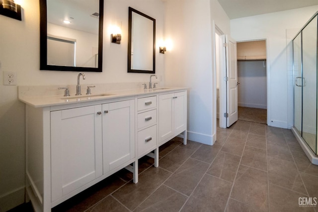 bathroom with vanity and an enclosed shower