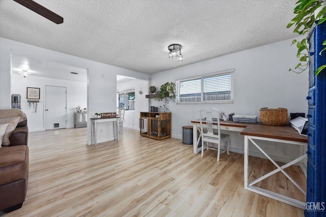 5906 Ronald Way, Bakersfield, CA 93308 - home office featuring light wood-style flooring, a textured ceiling, and ceiling fan