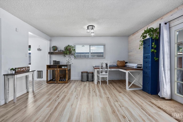 5906 Ronald Way, Bakersfield, CA 93308 - home office featuring wood finished floors, wood walls, and a textured ceiling