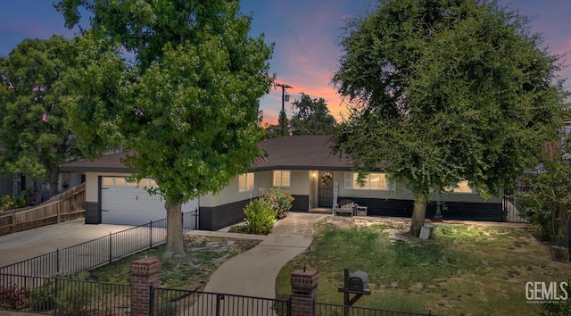 5906 Ronald Way, Bakersfield, CA 93308 - view of front of house with driveway, an attached garage, and stucco siding