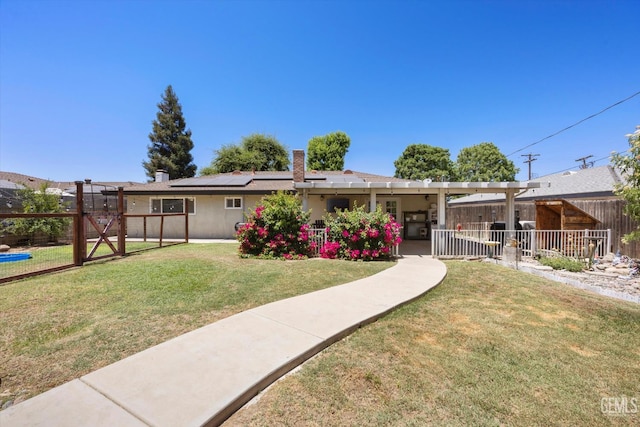 5906 Ronald Way, Bakersfield, CA 93308 - view of front facade with roof mounted solar panels, a gate, and stucco siding