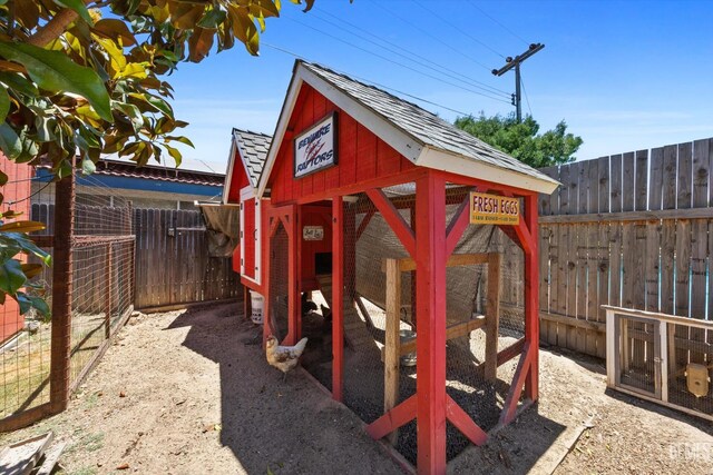 5906 Ronald Way, Bakersfield, CA 93308 - view of playground with exterior structure, an outbuilding, and a fenced backyard