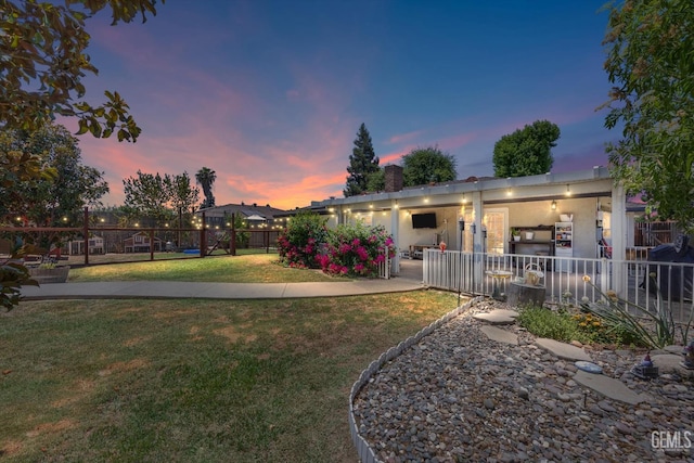5906 Ronald Way, Bakersfield, CA 93308 - yard at dusk with a patio area