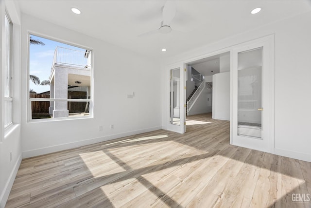 interior space with light hardwood / wood-style flooring and ceiling fan