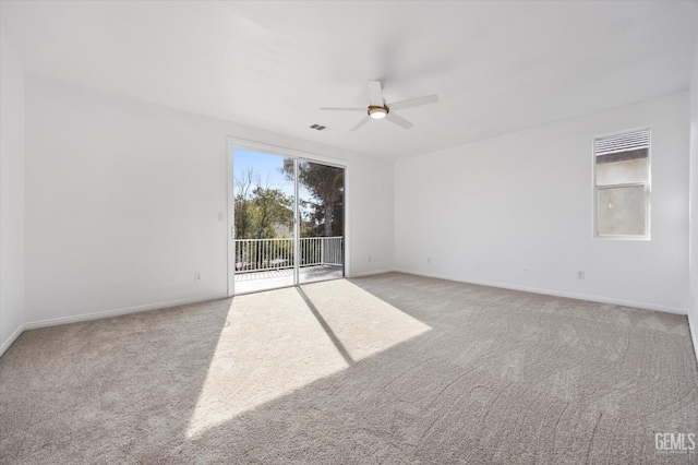 unfurnished room featuring ceiling fan and light carpet