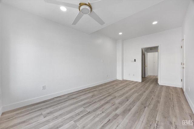 unfurnished room with ceiling fan and light wood-type flooring