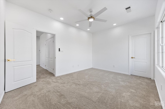 carpeted empty room with ceiling fan