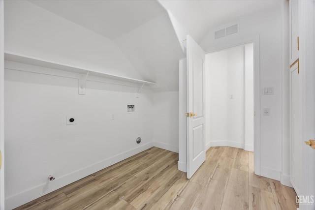 laundry area with hookup for a gas dryer, hookup for an electric dryer, washer hookup, and light wood-type flooring