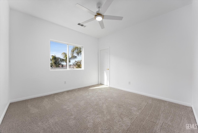 unfurnished room with ceiling fan and carpet floors