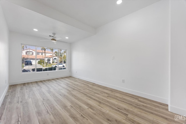 empty room with light hardwood / wood-style flooring and ceiling fan