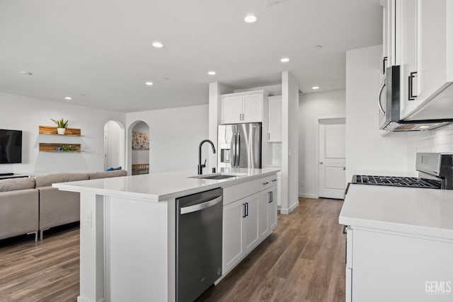 713 Winooski Ct, Bakersfield, CA 93314 - kitchen featuring stainless steel appliances, open floor plan, white cabinetry, recessed lighting, and wood finished floors
