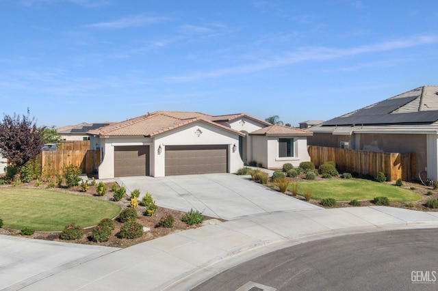713 Winooski Ct, Bakersfield, CA 93314 - single story home with a garage, stucco siding, driveway, and a tiled roof