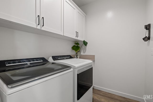 713 Winooski Ct, Bakersfield, CA 93314 - washroom featuring independent washer and dryer, cabinet space, and wood finished floors