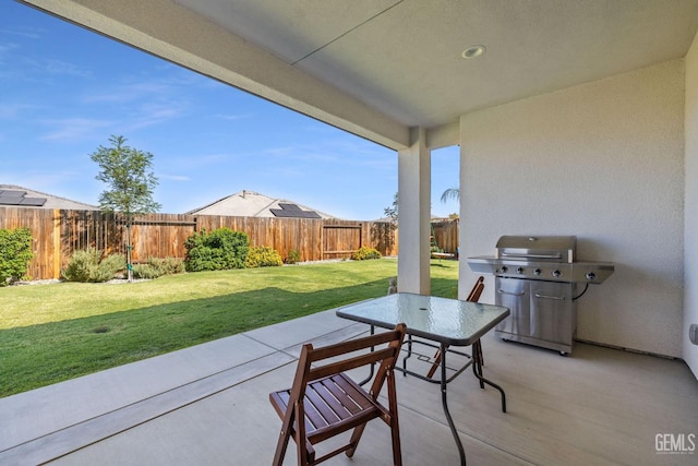 713 Winooski Ct, Bakersfield, CA 93314 - fenced backyard with a grill, a patio area, and outdoor dining space