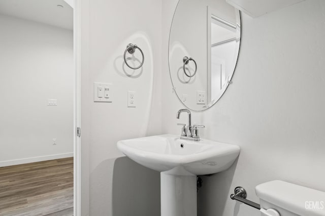 713 Winooski Ct, Bakersfield, CA 93314 - bathroom with wood finished floors and toilet