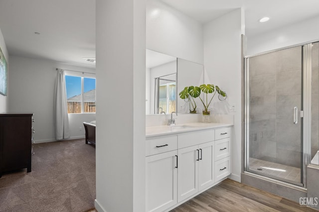 713 Winooski Ct, Bakersfield, CA 93314 - bathroom with vanity, a shower stall, and recessed lighting