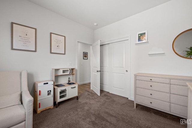 713 Winooski Ct, Bakersfield, CA 93314 - sitting room with dark colored carpet