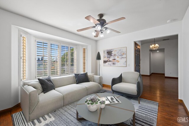 631 Faversham Way, Bakersfield, CA 93311 - living area featuring baseboards, a ceiling fan, wood finished floors, and a chandelier