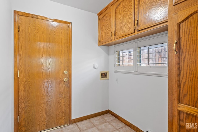 631 Faversham Way, Bakersfield, CA 93311 - laundry area featuring hookup for a washing machine, baseboards, cabinet space, and light tile patterned floors