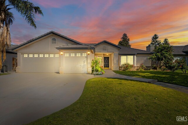 631 Faversham Way, Bakersfield, CA 93311 - single story home with driveway, an attached garage, stucco siding, a front lawn, and a chimney