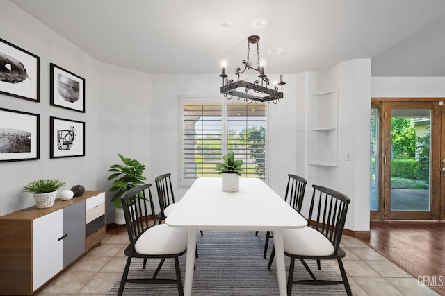 631 Faversham Way, Bakersfield, CA 93311 - dining space featuring a chandelier, light tile patterned floors, and baseboards