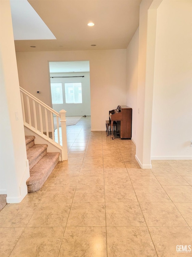 corridor featuring light tile patterned flooring