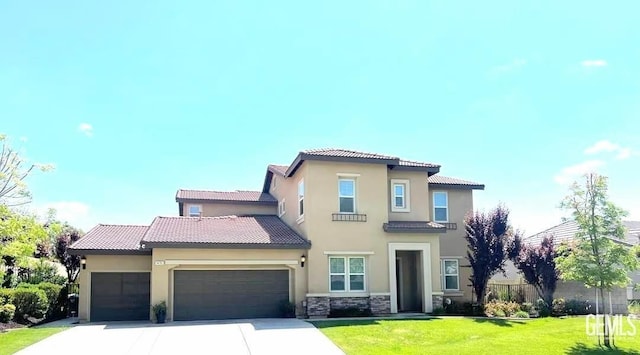 mediterranean / spanish home featuring a front yard